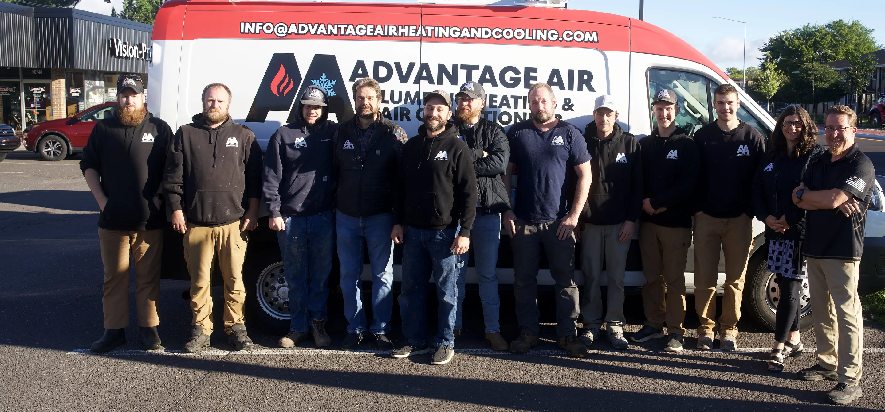 The Advantage Air crew with one of the vans on Tower Ave in Superior