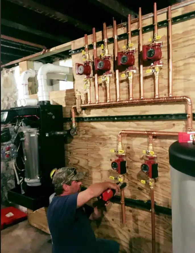 Advantage Air technician servicing a boiler